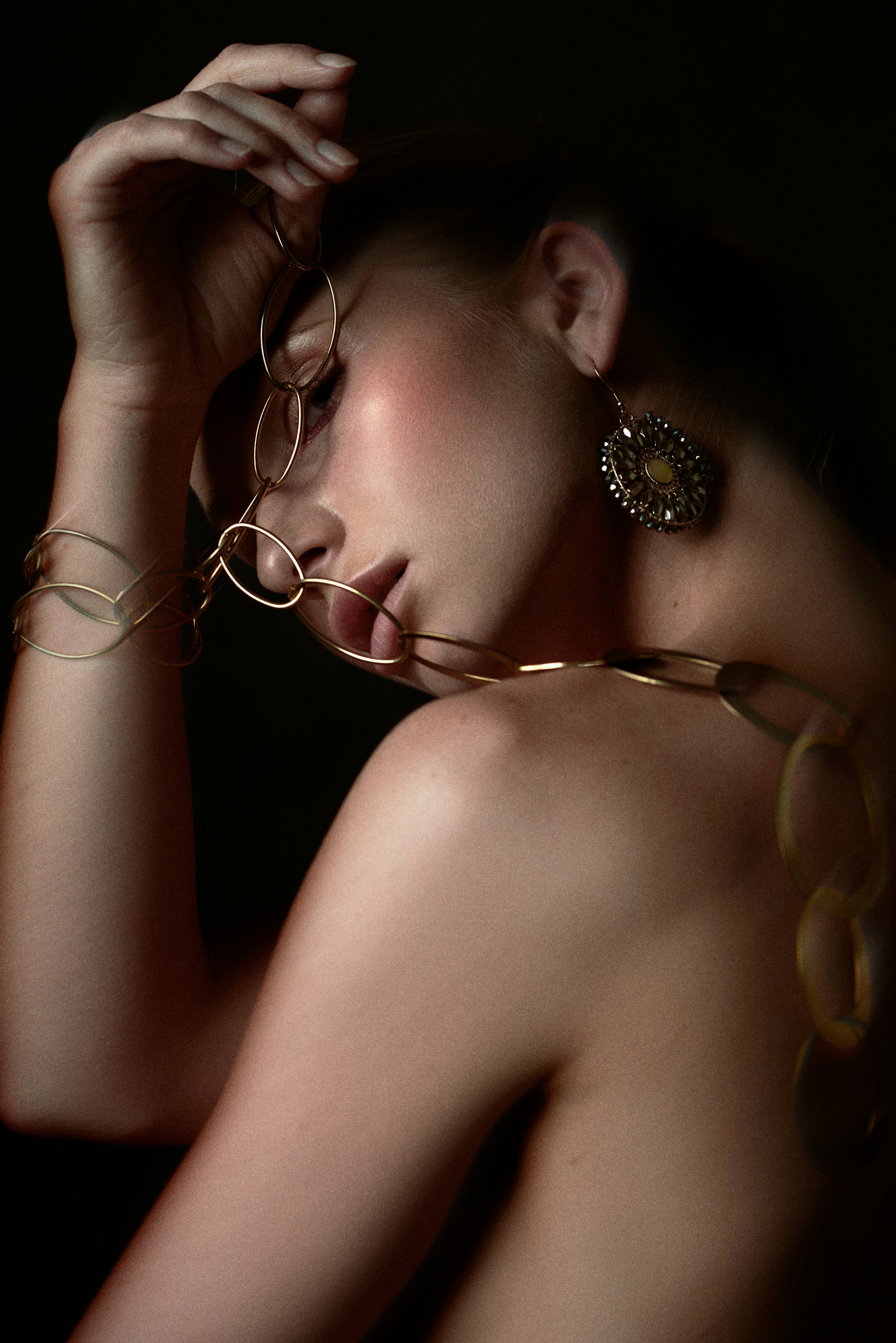 Gold jewellery on dark ground